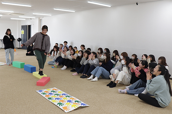 A scene of simulated childcare being divided into childcare worker and child roles.